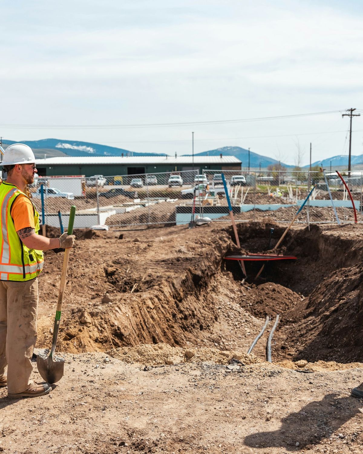 Field crew members in PPE on an active construction site