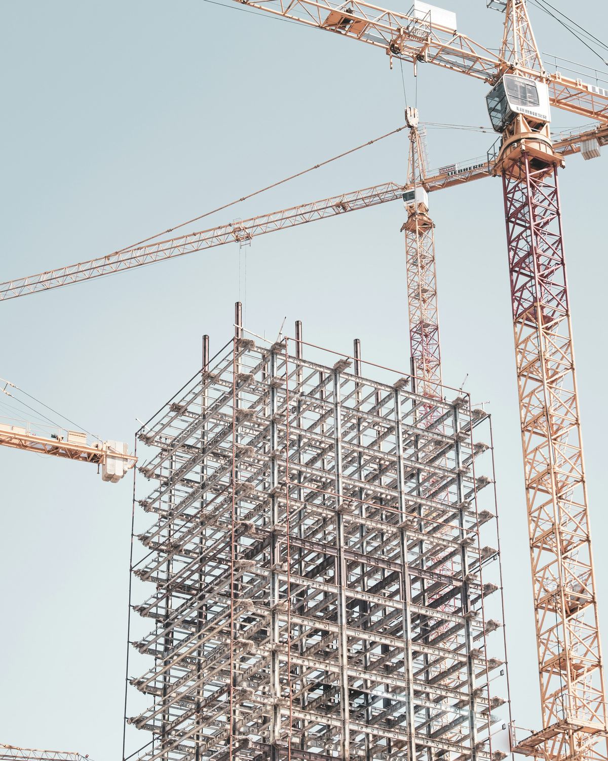 Structural steel and tower crane on a commercial job site