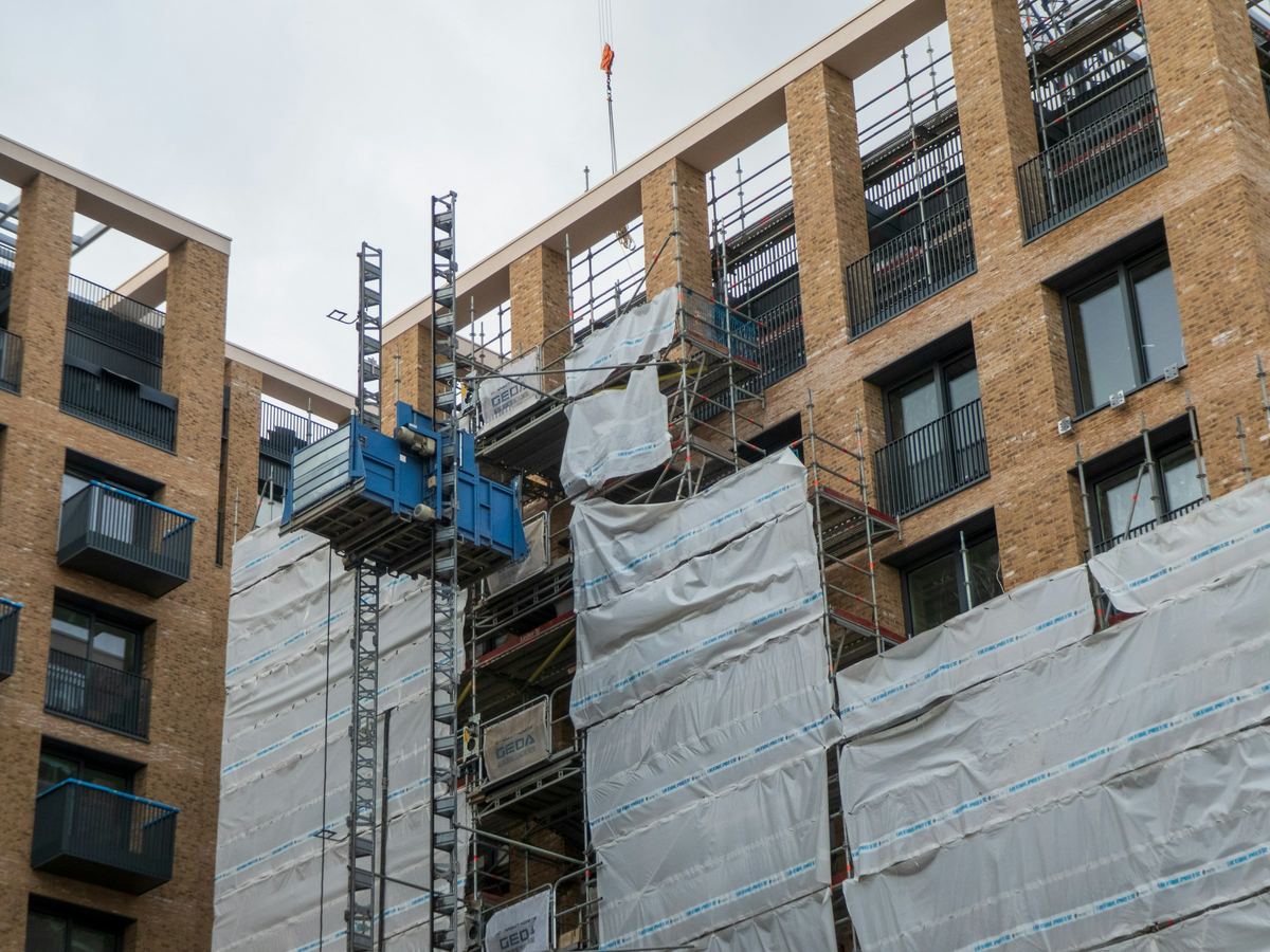 Multifamily building under construction with scaffolding