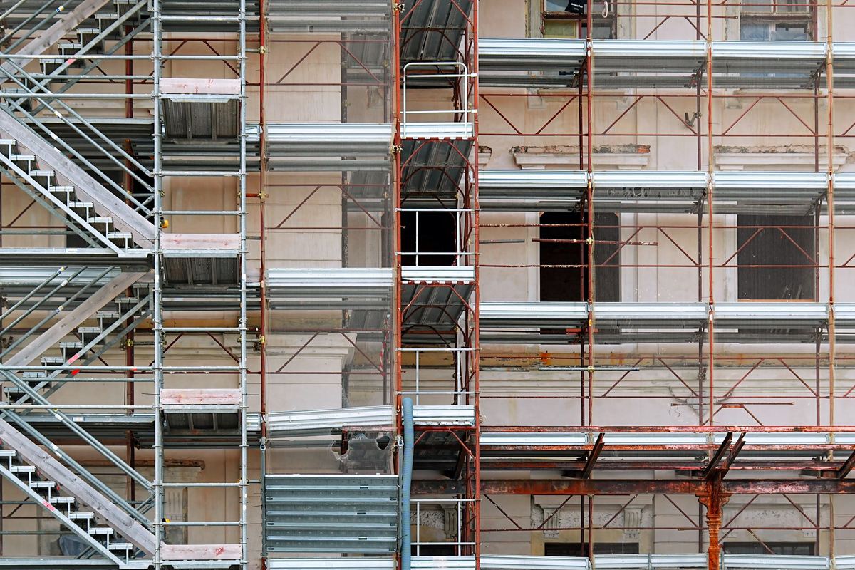 New construction with scaffolding along the facade