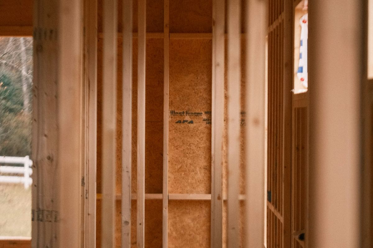 Wood-framed residential interior at rough-in stage