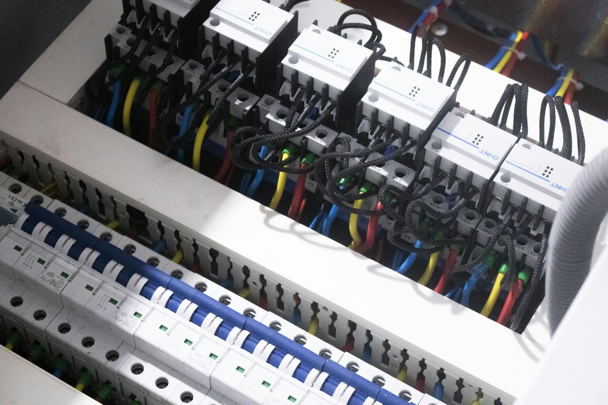 Organized conductors terminated in a distribution panel